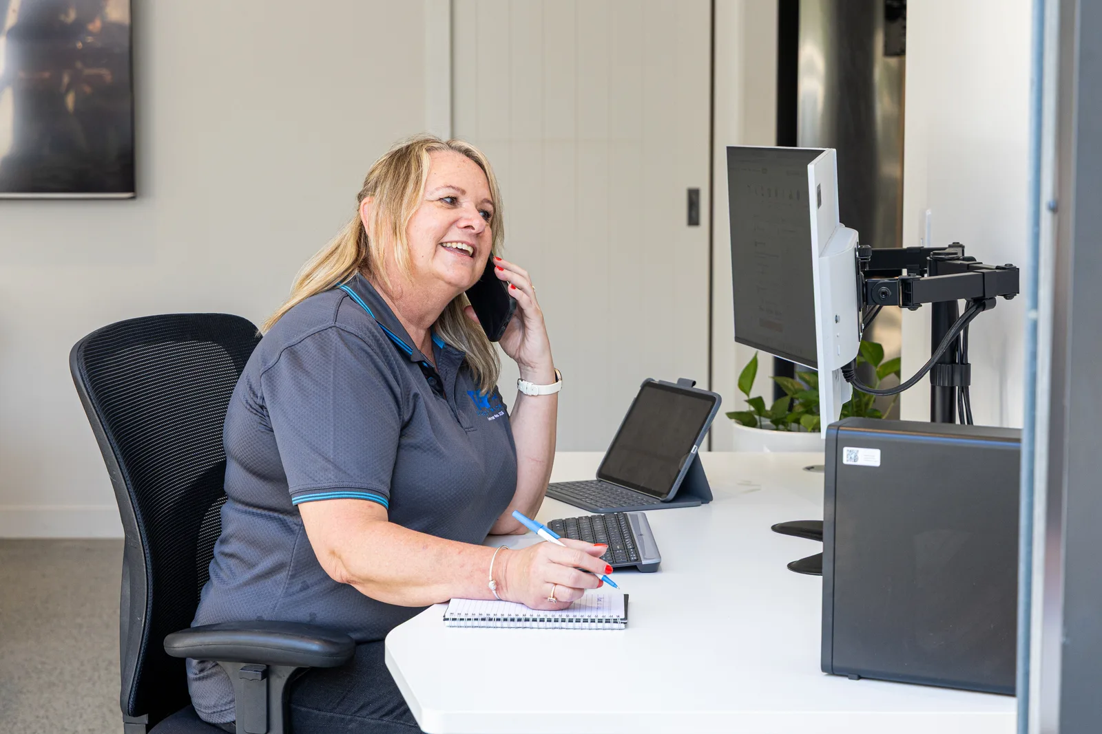 Office team member booking a job over the phone