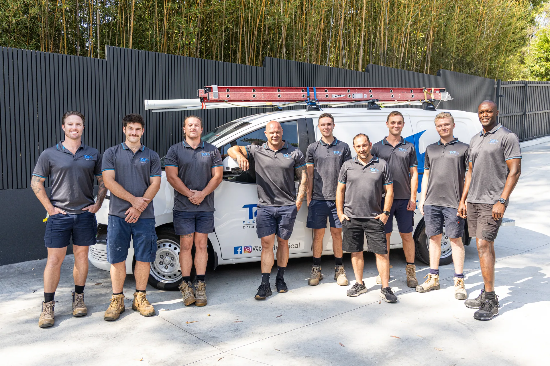 The Family Electrician Nerang team with a service van